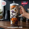Peanuts Snoopy Pumpkin Patch 40oz Tumbler Cup featuring Snoopy in a witch hat, ghosts, and pumpkins on an orange background.