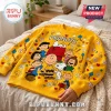Peanuts Snoopy Yellow Crewneck Ugly Sweater featuring Charlie Brown, Lucy, and various baseball themed icons on knit fabric.