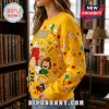 Peanuts Snoopy Yellow Crewneck Ugly Sweater featuring Snoopy, Charlie Brown, and Woodstock icons on a bright yellow fabric.