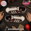 Pennywise It Horror Movie Casual Sneakers featuring clown graphics, red balloons, and white stripes on a wooden table.
