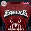 Philadelphia Eagles x Spider-Man Limited Edition shirt featuring a red fabric background, black spiderweb print, and logos.