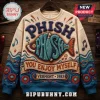 Phish Vermont 1983 Embroidered Ugly Sweater in beige with teal fish graphic, musical notes, and blue wave patterns.