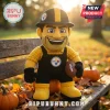 Pittsburgh Steelers NFL Mascot Plush Doll wearing a yellow shirt and black overalls, sitting on an outdoor wooden bench.