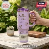 Premium Peanuts Snoopy Purple 40oz Stanley Tumbler featuring line art of Snoopy and hearts on a light purple surface.