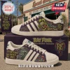Rat Fink x Adidas Purple Casual Shoes featuring green monster graphics, cream leather accents, and white three-stripe design.