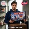 Red Bull Edition Monopoly Board Game Set held by a man wearing a dark navy blue hoodie in a studio setting.