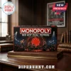 Red Hot Chili Peppers Collector Edition Monopoly Board Game box featuring a concert stage graphic on a wooden table.