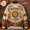 Rotary International Service Above Self beige ugly sweater featuring a gear emblem, fall foliage, and mountain forest print.
