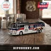 Route 66 100th Anniversary Die-Cast Metal Coach with black, red, and silver paint parked on a wooden table.