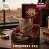 Route 66 100th Anniversary Engraved Whiskey Glass inside a wooden display box featuring vintage highway illustrations.