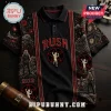 Rush 2112 Starman Black Polo Shirt with red pentagram graphics, band members, and clock tower details on dark fabric.