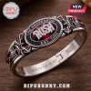 Rush Band Closer To The Heart bracelet featuring The Professor text, an owl motif, and engraved lyrics on a metal band.