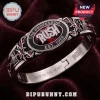 Rush Band Closer To The Heart Bracelet with black enamel center, silver-tone metal, red gemstones, and owl engravings.