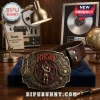 Rush Starman 1968 Embossed Leather Belt featuring a bronze-toned metal buckle with Starman icon and band logo on dark leather.