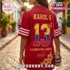 San Francisco 49ers Karol G Floral Red Football Jersey with yellow and blue number 13, butterfly graphic, and text details.