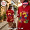 San Francisco 49ers Karol G Floral Red Football Jersey featuring yellow, blue, and red number 13 with hibiscus graphics.