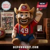 San Francisco 49ers NFL Cowboy Mascot Plush Doll wearing a team hat, red shirt with number 49, and jeans, held in a hand.