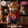 San Francisco 49ers NFL Cowboy Mascot Plush Doll wearing a team-branded hat and red shirt with number 49 in a library.