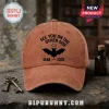 See You On The Other Side Bat 1948-2025 Baseball Cap in rustic brown cotton with black graphic and text on a wooden surface.