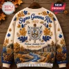 Sigma Gamma Rho Sorority Mascot Ugly Sweater in cream with royal blue and gold embroidery, featuring crest and maple leaves.