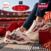 Skechers Kansas City Chiefs D'Lites chunky sneakers featuring team mascot, red branding, and white leather base.