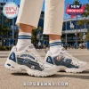 Skechers Los Angeles Dodgers D'Lites White Sneakers featuring blue stadium graphics and baseball stitching details.