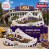 Skechers LSU Tigers D'Lites White Athletic Sneakers featuring purple and gold graphics of Tiger Stadium and mascots.