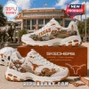 Skechers Texas Longhorns Mascot White Walking Sneakers featuring orange stadium graphics and cartoon longhorn character art.