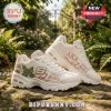 Skechers x Alpha Kappa Alpha Pearl Embroidered D Lites Sneaker in cream with green ivy and pearl detailing on stone ground.