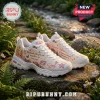 Skechers x Dolly Parton D'Lites white platform sneaker featuring floral prints, butterflies, and Dolly Parton graphics.