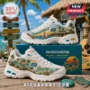 Skechers x Jimmy Buffett D'Lites White Tropical Sneakers featuring vibrant island, sailboat, and musician graphics.