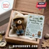 Smokey Bear Felt Pocket Hug Doll wearing a tan hat and blue jeans holding a shovel inside a wooden keepsake box.
