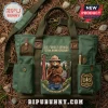 Smokey Bear USFS 120th Anniversary Green Canvas Tote Bag with forest service patch, brown leather accents, and gear pockets.
