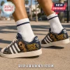 Snoop Dogg Fo Shizzle Embroidered Casual Shoes featuring navy blue canvas, gold portrait graphics, and white rubber soles.