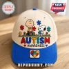 Snoopy Autism Awareness Cream Blue Baseball Cap featuring Charlie Brown, Snoopy, and colorful puzzle pieces on a hat.