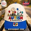 Snoopy Autism Awareness Cream Blue Baseball Cap featuring Charlie Brown, Snoopy, and colorful puzzle pieces on the front.