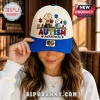 Snoopy Autism Awareness Cream Blue Baseball Cap featuring Charlie Brown and Snoopy with puzzle pieces on a cream background.