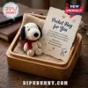 Snoopy Dog Felt Ornament with Pocket Hug Card featuring a white beagle plush, red scarf, and paper note in a wooden box.