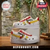 Snoopy Peanuts White Air Force 1 Low Top sneakers with comic strip prints, yellow swooshes, and red heel accents.