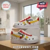 Snoopy Peanuts White Air Force 1 Low Top sneakers with yellow swoosh and comic strip illustrations on a white background.