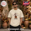 Snoopy x Spider-Man Halloween Beige T-Shirt featuring Snoopy in a spider suit sitting on a pumpkin with text.