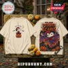 Snoopy x Spider-Man Halloween Beige T-Shirt featuring Peanuts character in a spider suit with pumpkins and a spooky city.