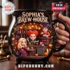 Sophia's Brew House Witch Sisters Ceramic Cauldron Mug featuring three witch figures in a cozy potion shop scene.