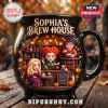 Sophia's Brew House Witch Sisters Ceramic Cauldron Mug featuring three illustrated witches in a shop with shelves of potions.