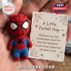 Spider-Man Felt Pocket Hug doll held in hand next to a card with spider web illustrations and supportive text.