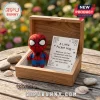 Spider-Man Felt Pocket Hug inside a wooden box with a printed note featuring web illustrations and supportive text.
