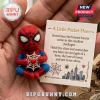 Spider-Man Handmade Felt Pocket Hug miniature figure holding a web, displayed on an encouragement card held in a hand.
