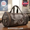 Star Wars Mandalorian Embossed Utility Duffle Bag with grey metallic helmet detailing, brown trim, and armor plate accents.