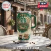 Starbucks 55th Anniversary YETI Stanley tumbler with green tie-dye pattern, logo, and coffee graphics on marble table.