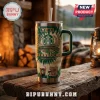 Starbucks 55th Anniversary YETI Stanley tumbler with green tie-dye pattern, logo, and coffee graphics on wood table.
